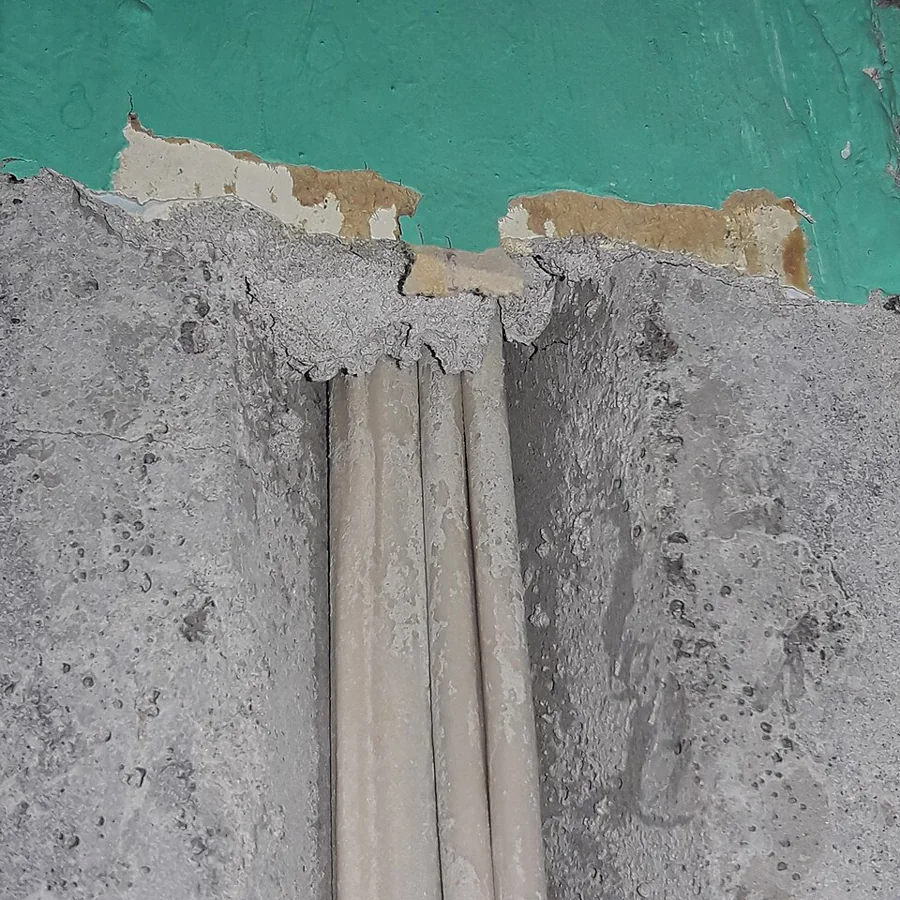 Fresh plaster and render being applied to an interior wall